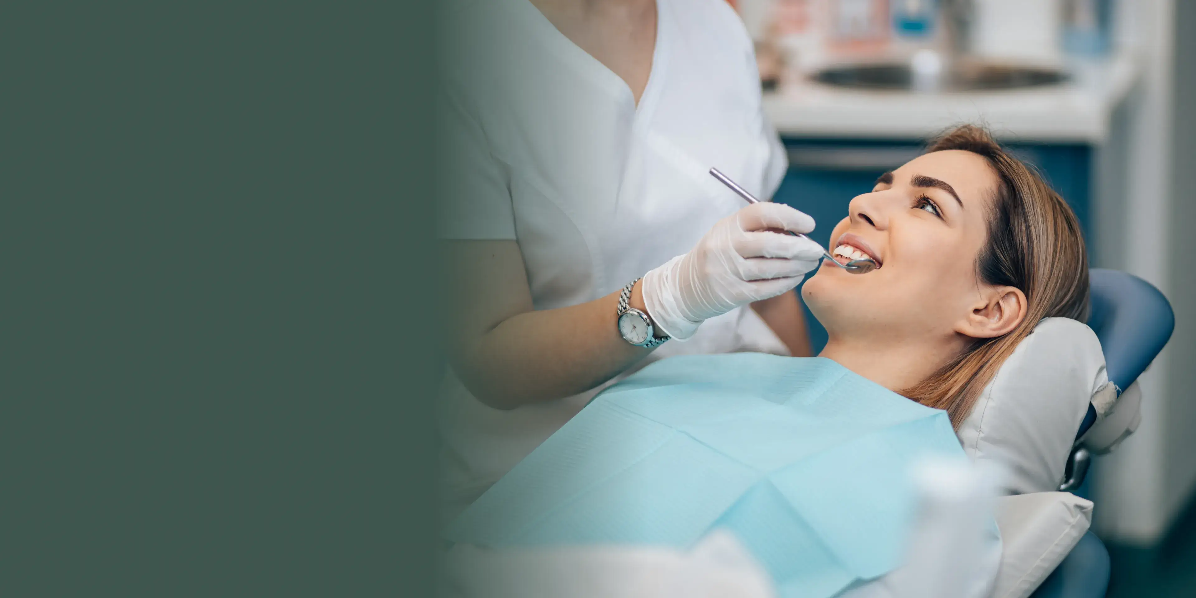 A woman getting her teeth checked by a dentist.