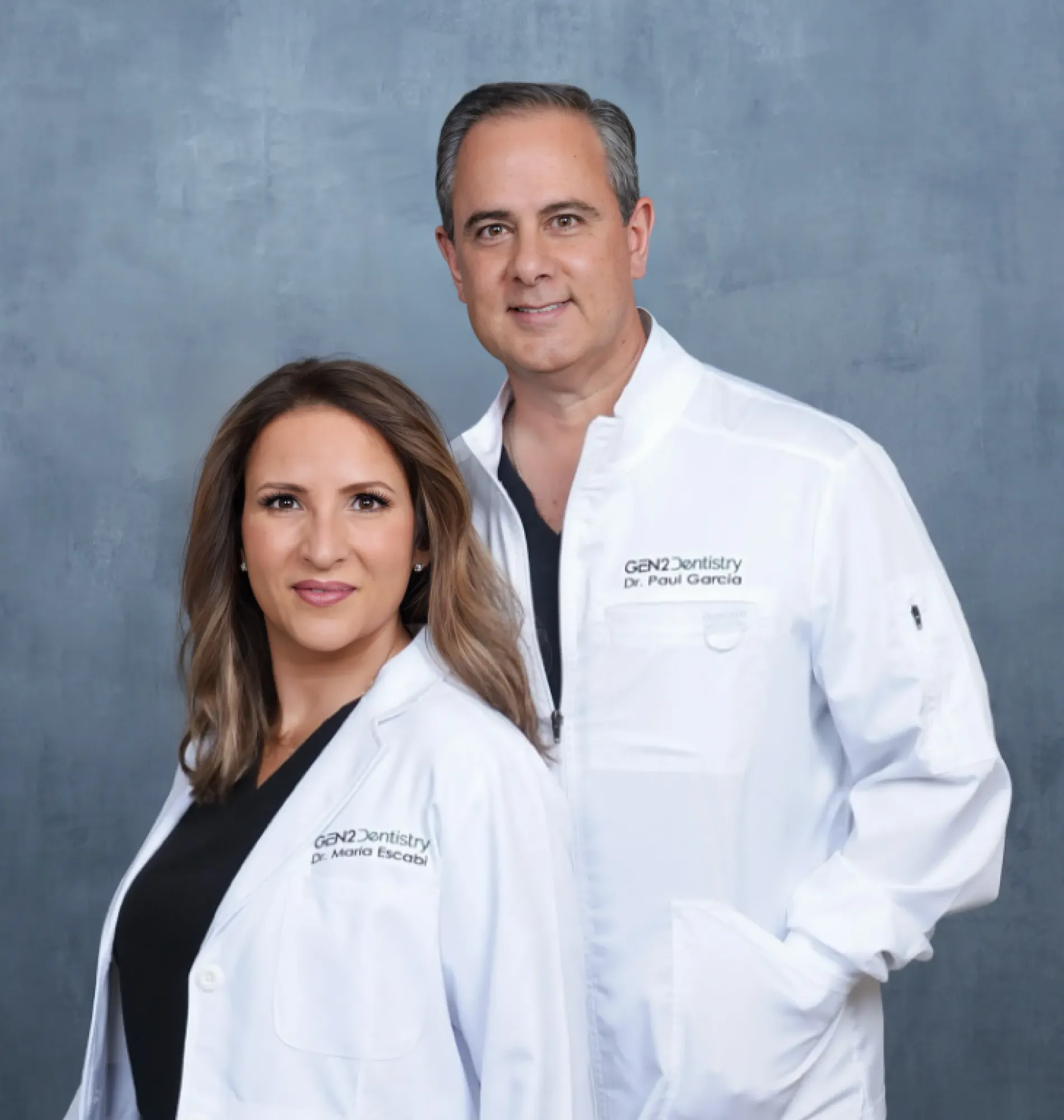 A couple wearing a white shirt lab coat