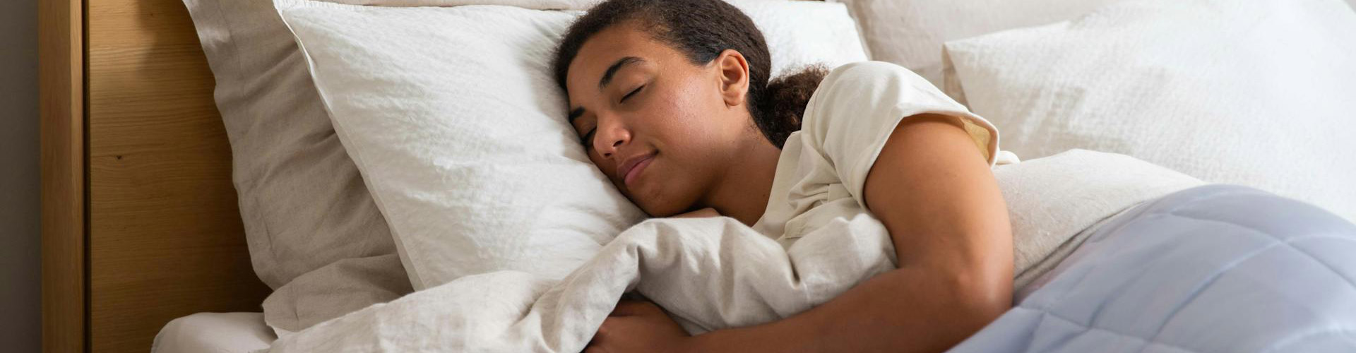 woman sleeping on a mattress