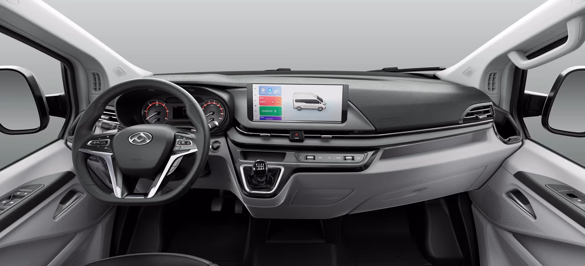 Clean and modern vehicle dashboard with a leather steering wheel, digital speedometer, touchscreen display showing a van, and gear shift lever.