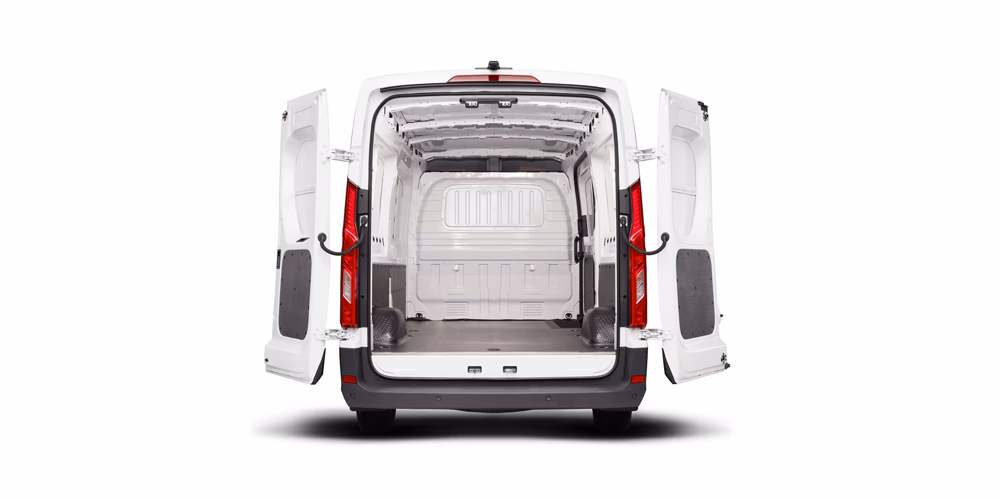 Rear view of an empty white cargo van with both rear doors open, showing the spacious interior.