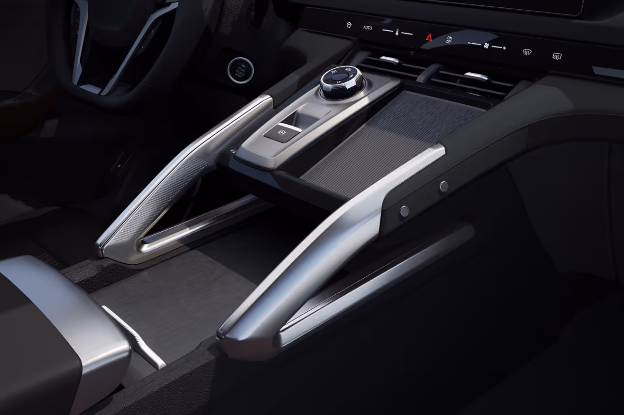 Modern car center console featuring a rotary gear selector, electronic parking brake button, and dual silver accent rails.