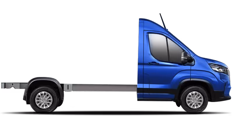 Side view of a blue flatbed truck with two wheels and no cargo on the back.