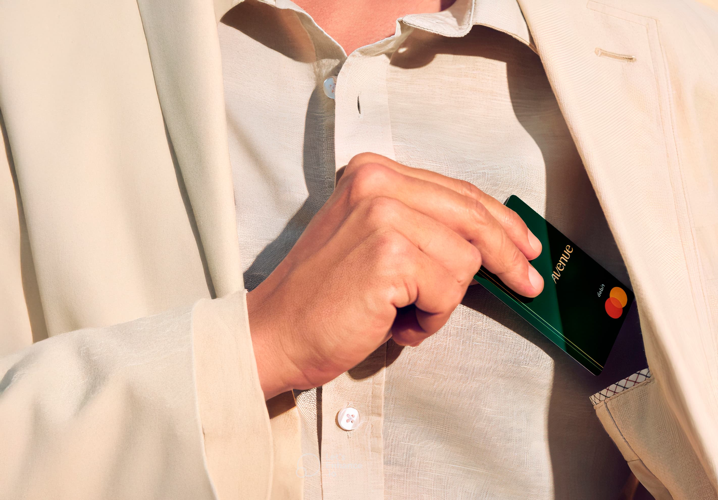 Man with an Avenue card putting into a pocket