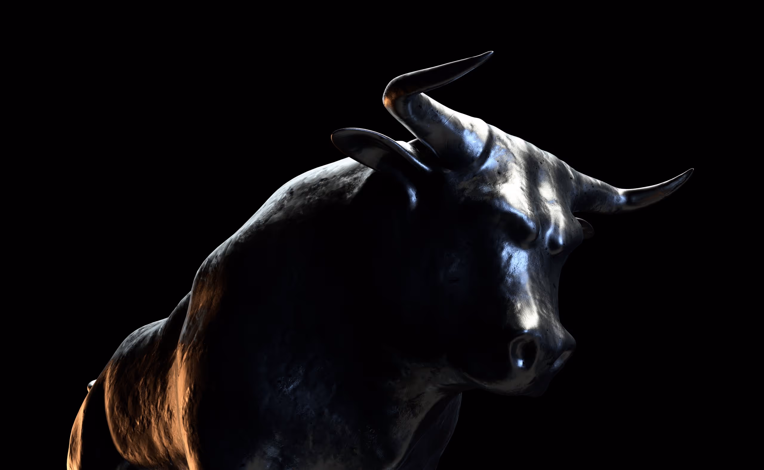 A statue of a bull with horns and a black background.