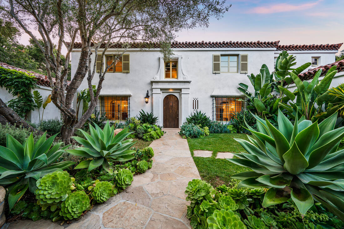 Spanish-style private residence surrounded by mature landscaping.