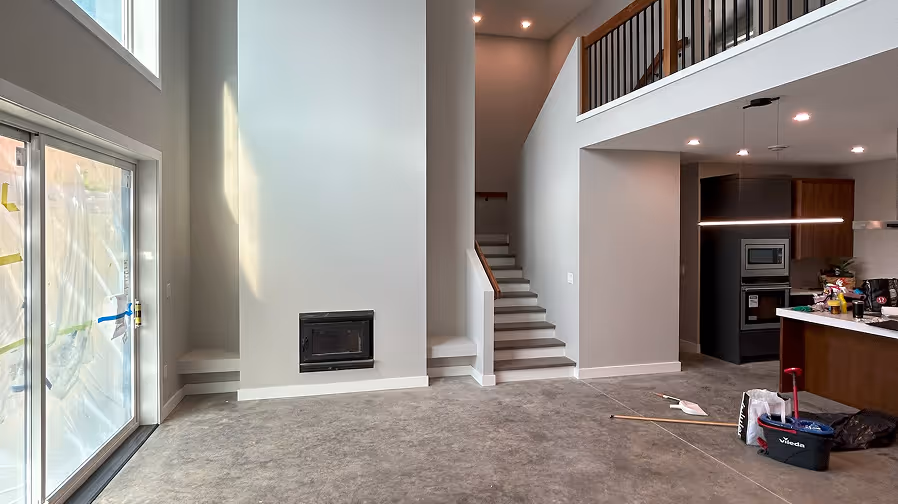 A clean living room with stairs