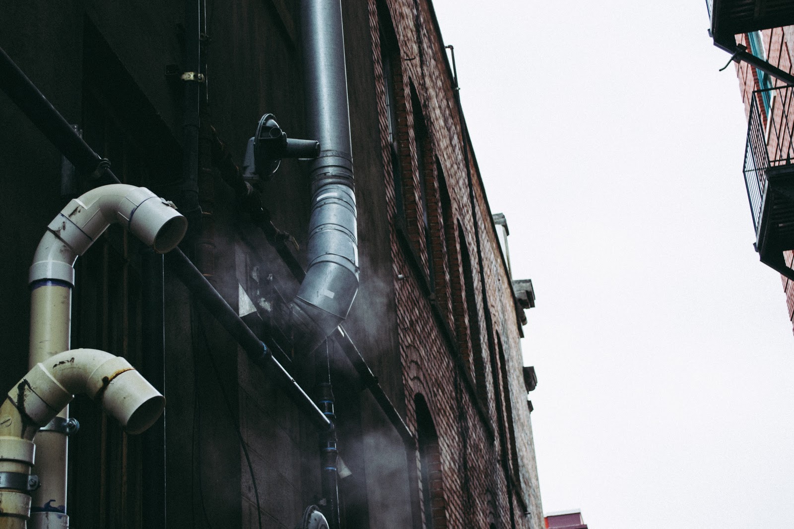 PVC Plastic (one of the 7 types of plastics) pipes outside a building