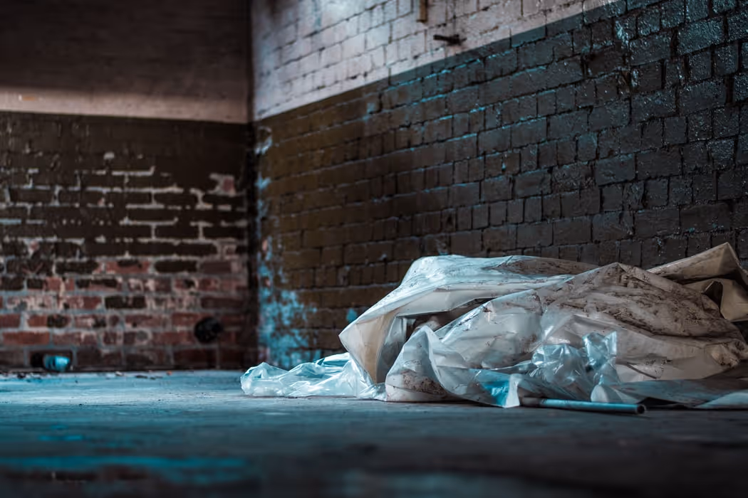 Dirty plastic sheets lying on the ground