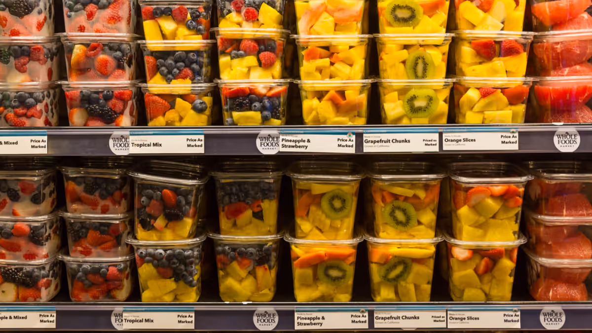 Fruits in plastic containers at a supermarket that will have a negative impact on human health