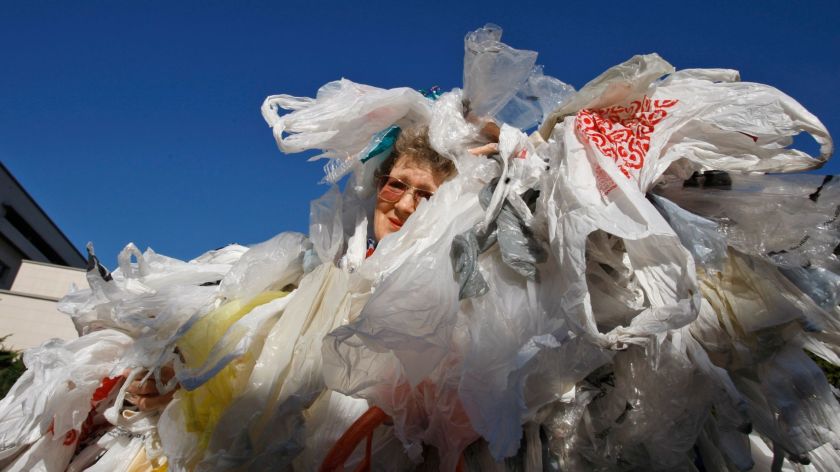 A woman covered in plastic bags 