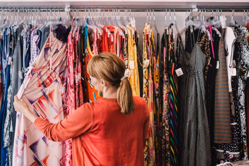 A consumer buying clothes consciously