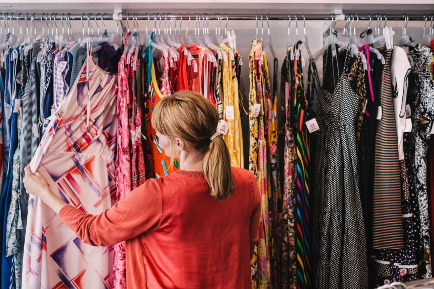 A consumer buying clothes consciously