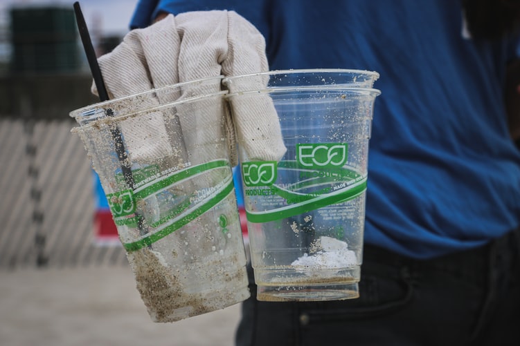 2 plastic cups saying they're eco friendly
