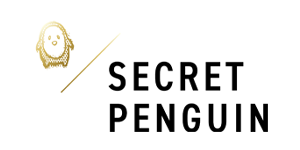 Logo with a simple, line drawing of a penguin's face and wings on the left, followed by a thin diagonal line dividing the image. On the right, in bold black uppercase letters, is the text "SECRET PENGUIN" stacked over two lines. The background is white.