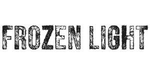 Black, textured text on a white background spelling "FROZEN LIGHT". The font appears rough and distressed, giving the letters an icy or weathered look.