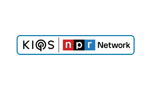 A rectangular logo with a white background and a thin blue border. On the left side, it says "KIOS" in black letters; the letter "O" is stylized with a design resembling a radio signal or podcast icon. A thin gray vertical line separates "KIOS" from the next section, which features the recognizable "npr" logo—each letter in a separate colored box (red for "n", black for "p", blue for "r"). To the right of "npr", the word "Network" is written in black text.