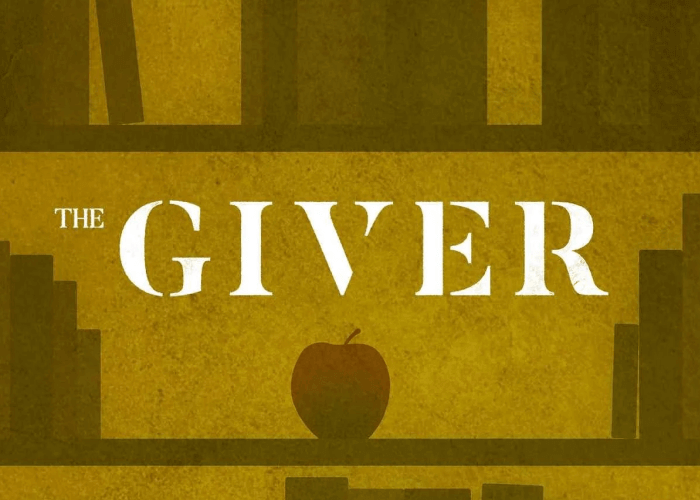 A minimalist book cover design. The background is a yellowish-brown color resembling aged paper, with the silhouettes of bookshelves and books. In the center is a red apple, and above it, large white text reads: "THE GIVER." The font is bold, serif, and all uppercase except for "THE," which is in smaller letters beside the word "GIVER."