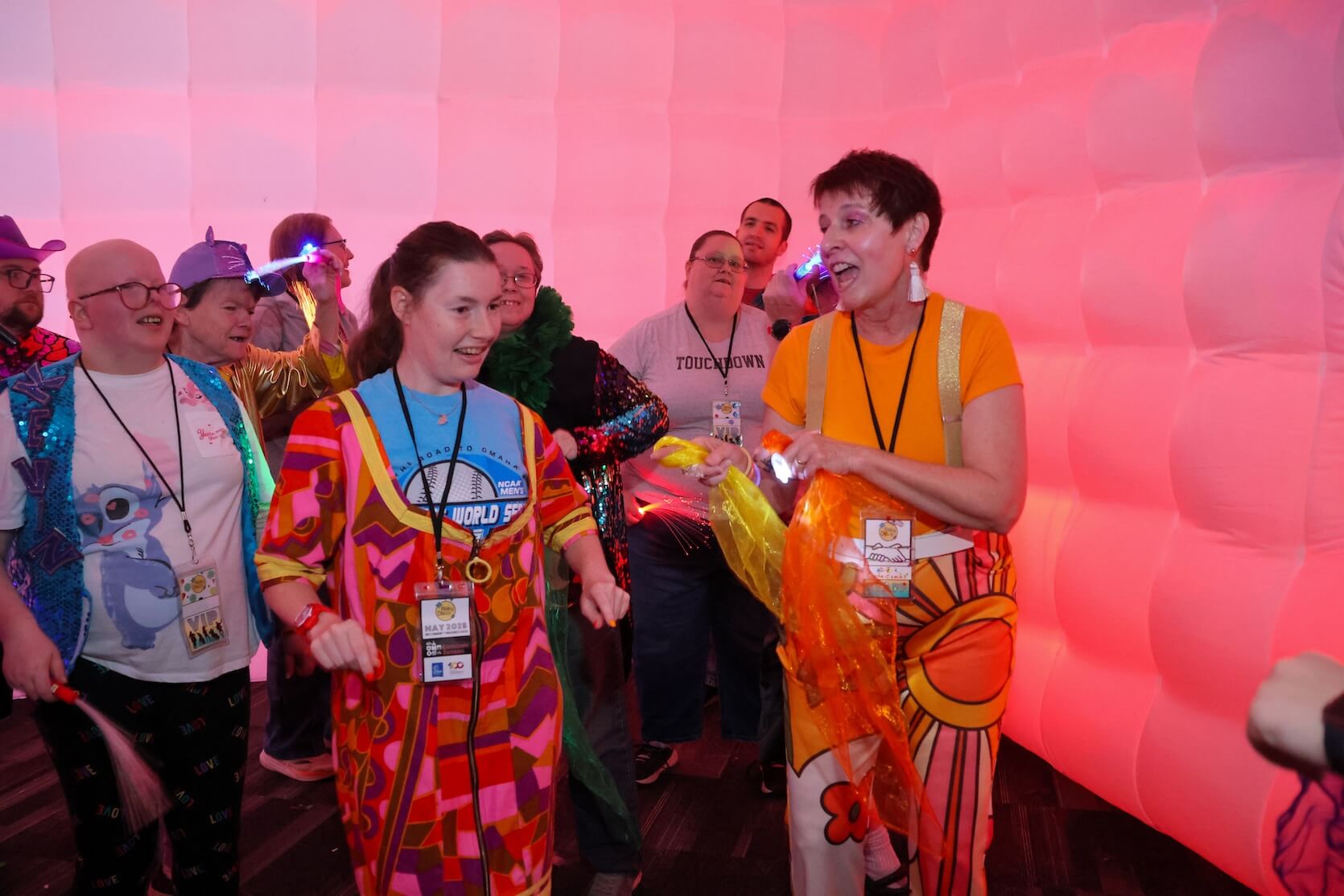 Group of exhibit attendees focusing on the speaker, learning about the exhibit.