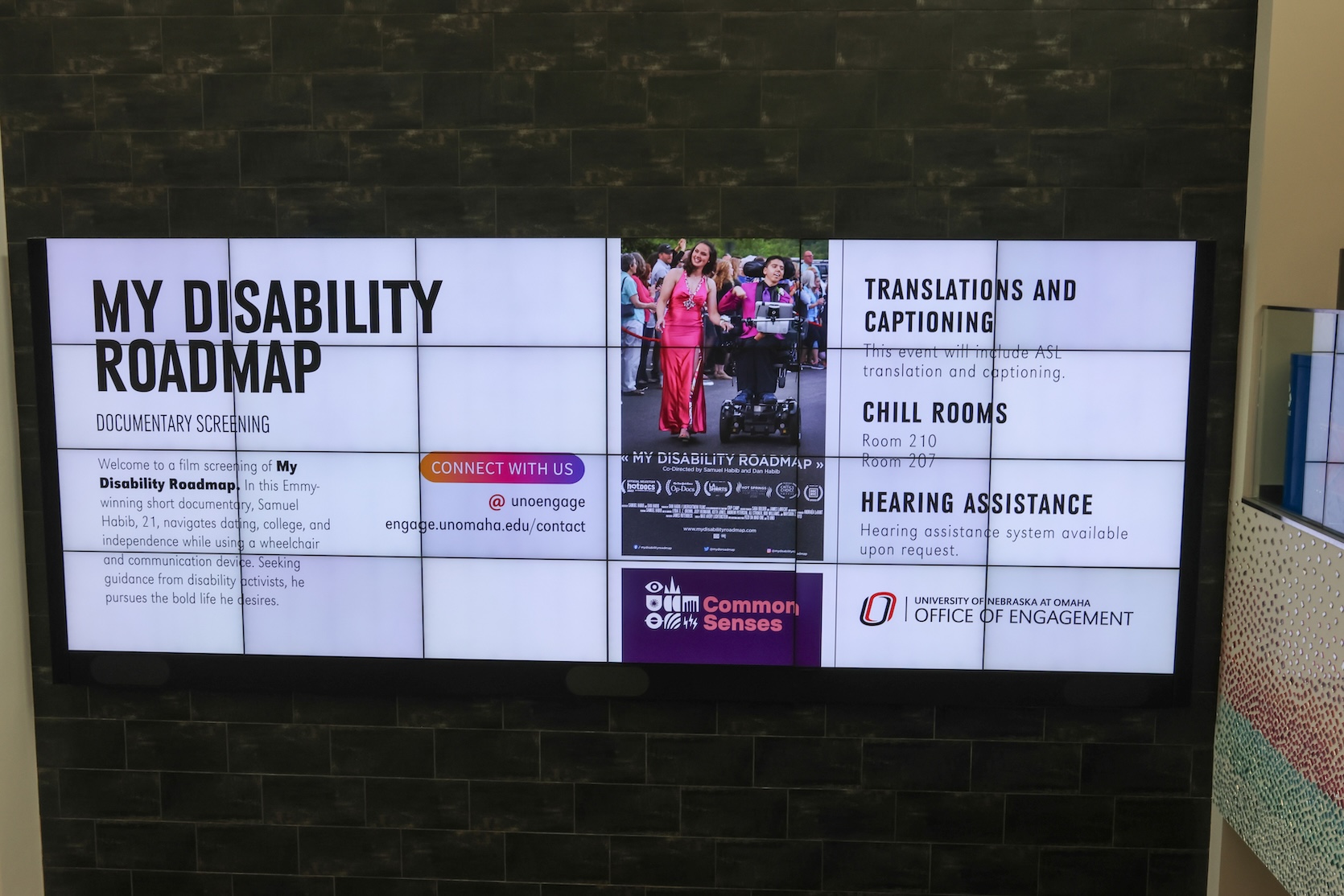 Electronic sign showcases My Disability Roadmap, explaining the documentary that people will see and the accessibility options provided.