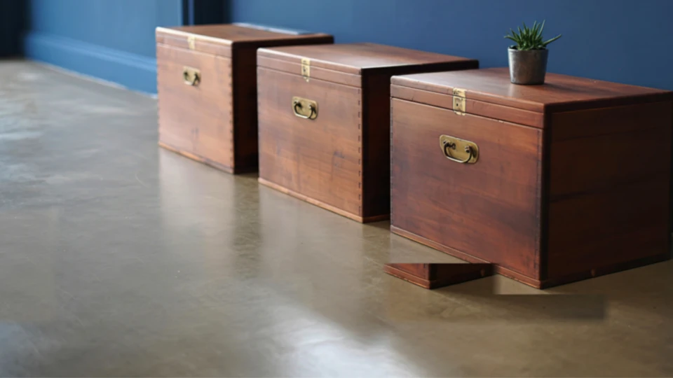 Polished concrete floor in a modern living room with a glossy finish reflecting natural light