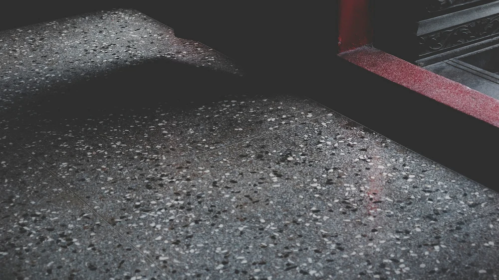 Metallic epoxy floor with swirling silver and gray patterns in a Santa Barbara showroom