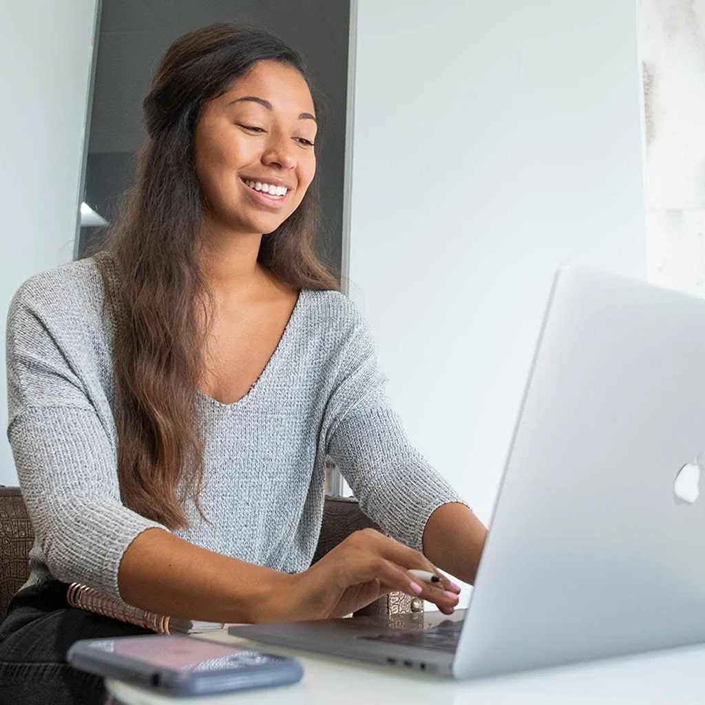 Employee working on a laptop.