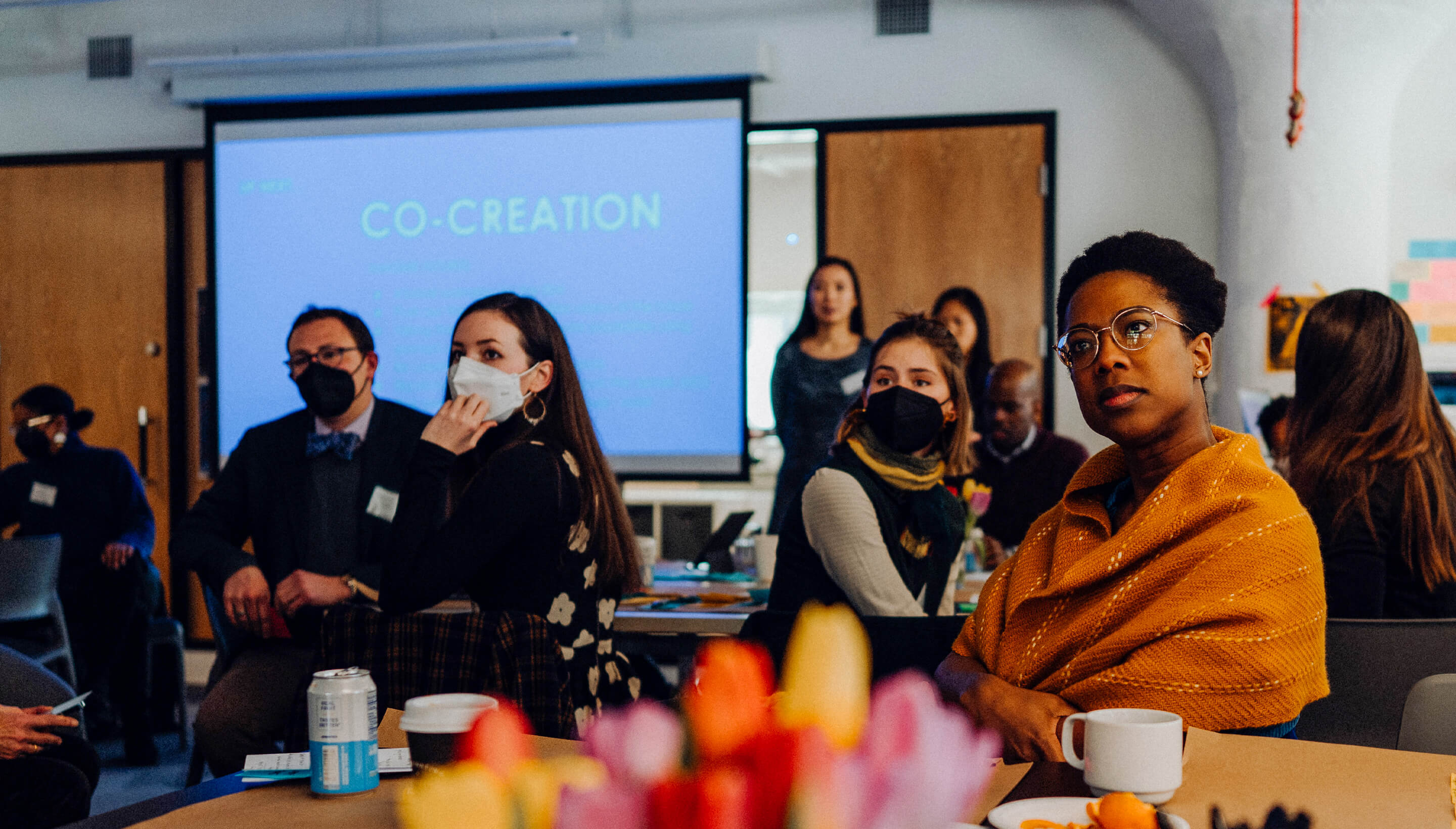 A diverse group of people at a co-design session