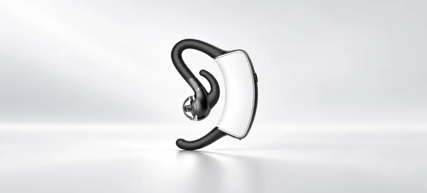 Wireless bone-conduction earbud with ear hook on a white surface