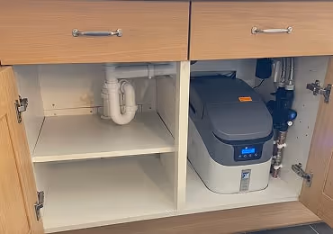 Plumbing under a sink