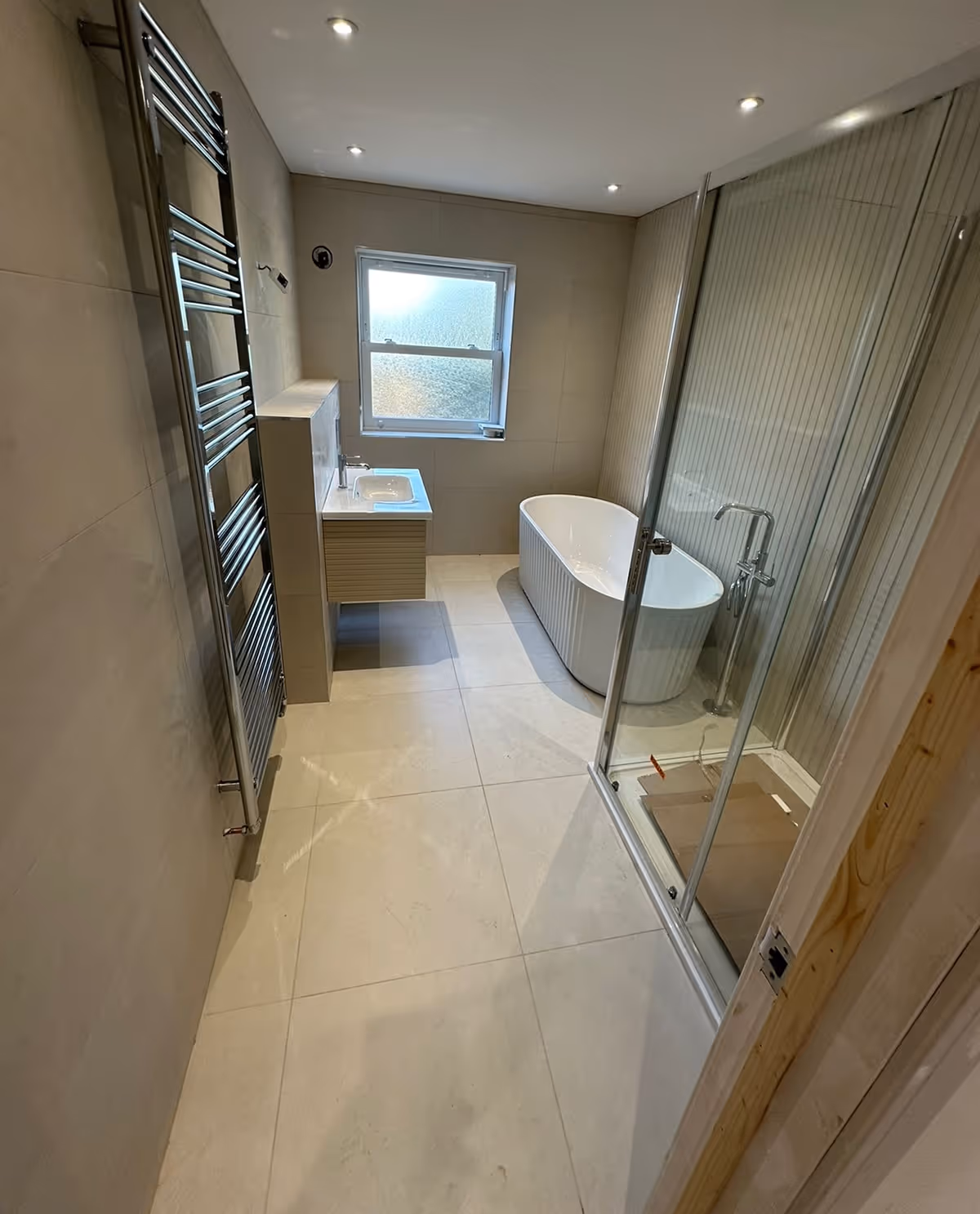 New bathroom installation with grey tiling