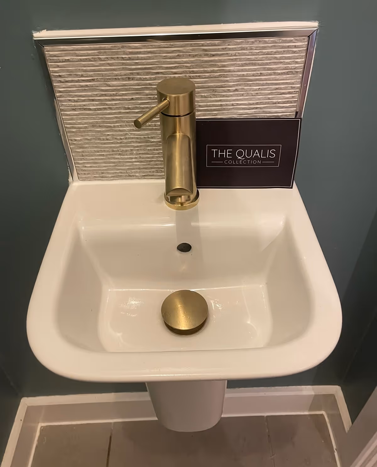 Gold tap on a new basin