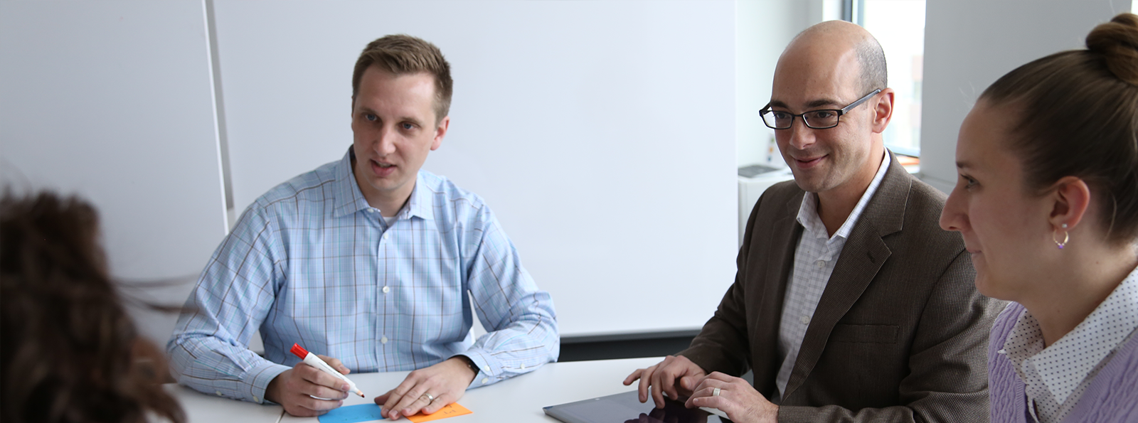 Team members collaborating in a meeting.
