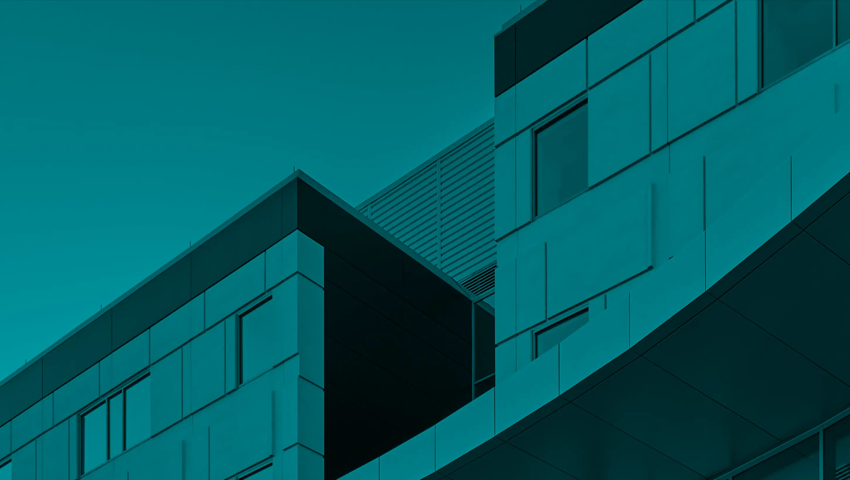 Modern building exterior with geometric and curved design elements.