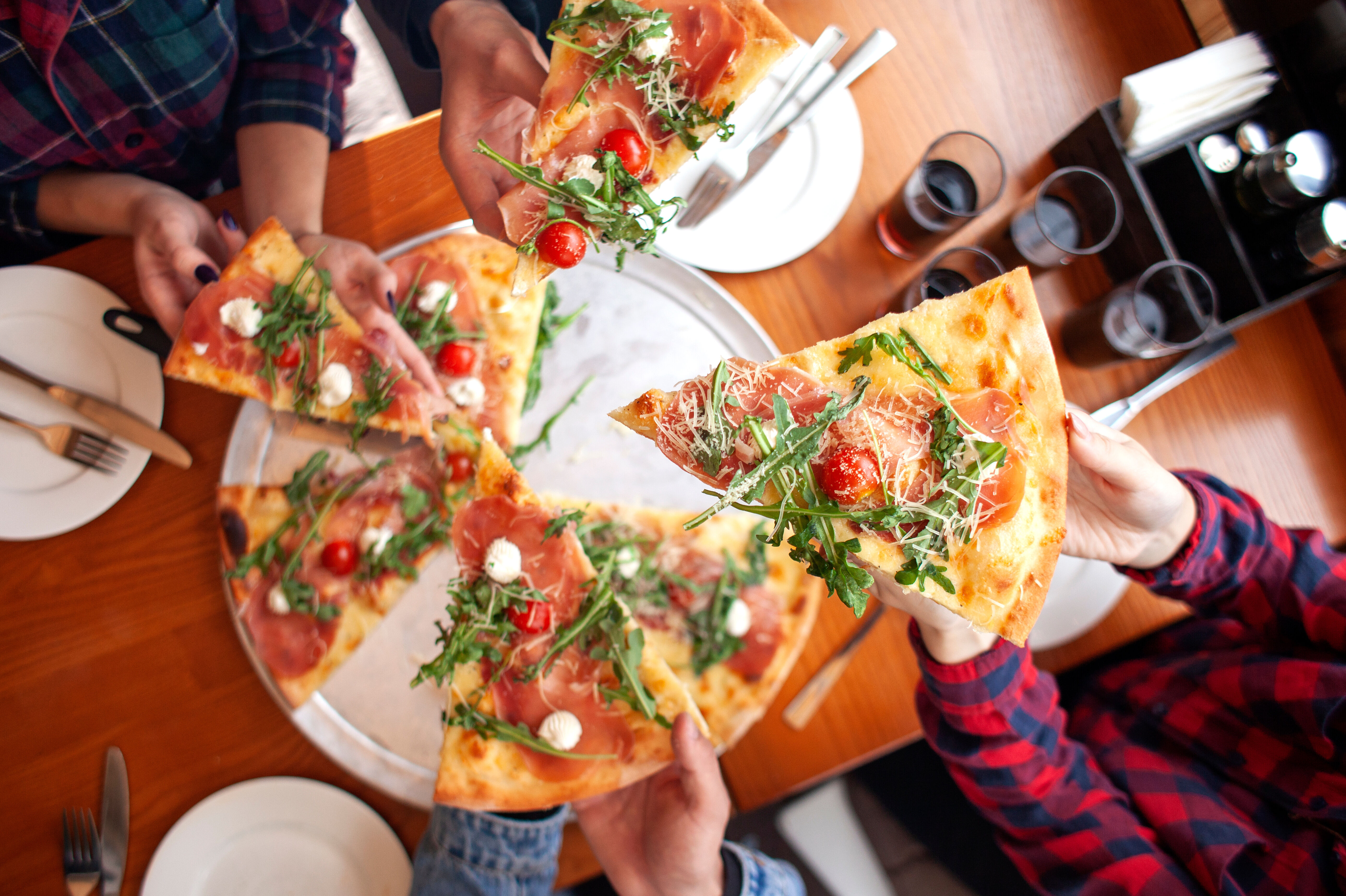 grabbing pizza stock image