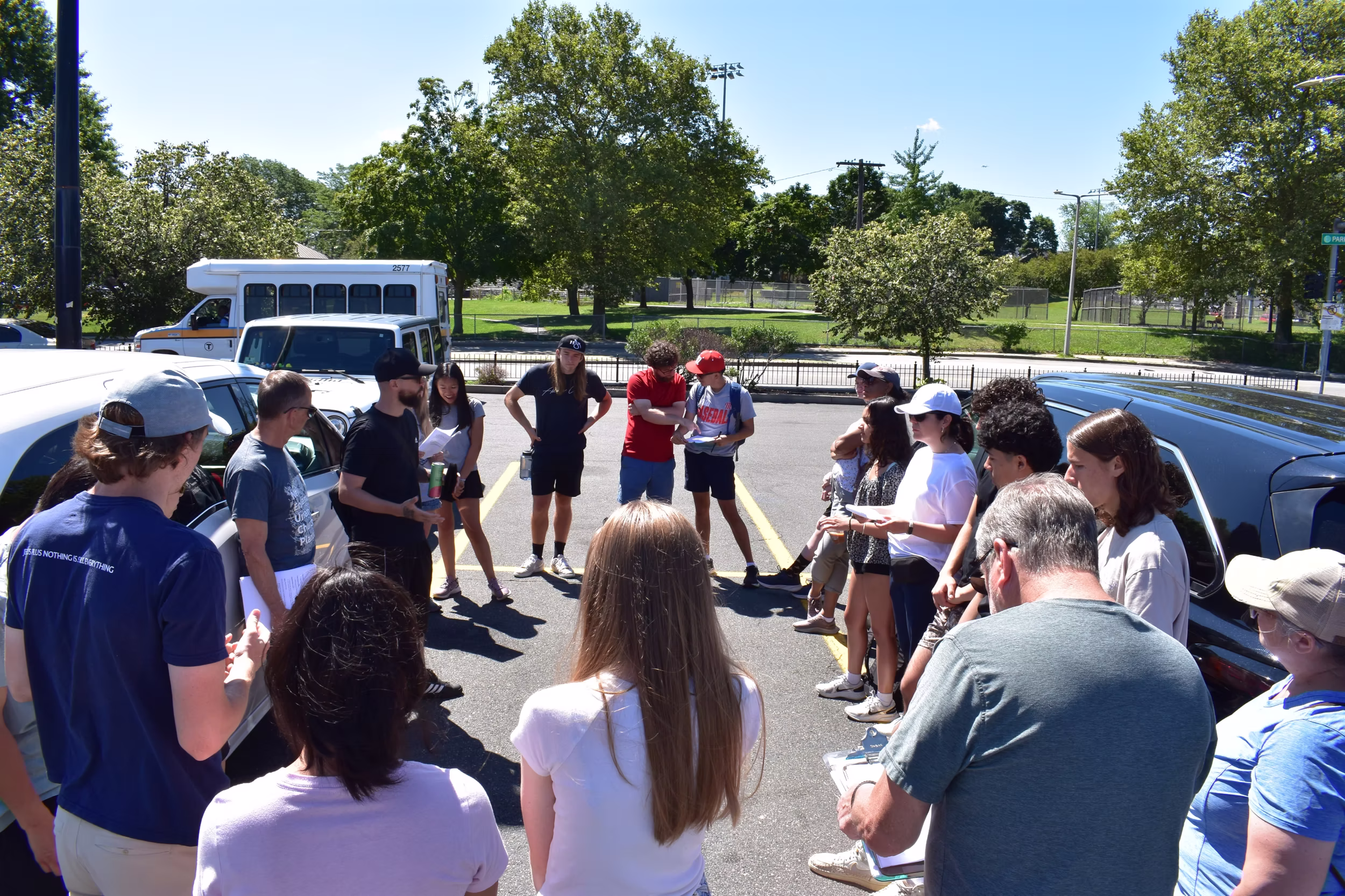 A group gathers outside.