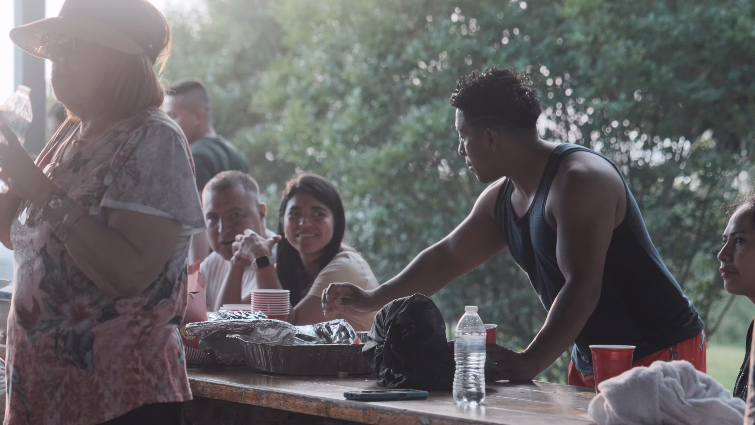 People share food at beach table
