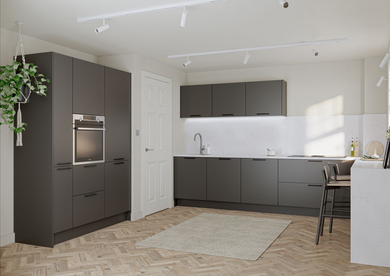 Modern kitchen with matte graphite cabinets, built-in oven, white countertops, wooden herringbone floor, a beige rug, and a hanging plant.
