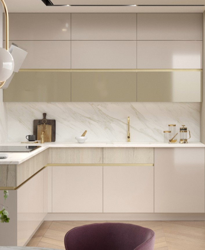 Modern kitchen with white and beige cabinets, marble backsplash, gold faucet, and countertop accessories including cutting boards, a mortar and pestle, and glass jars.