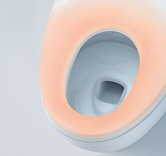 Toilet bowl with a warm glowing seat indicating heated function.