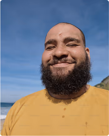 Man in yellow shirt smiling