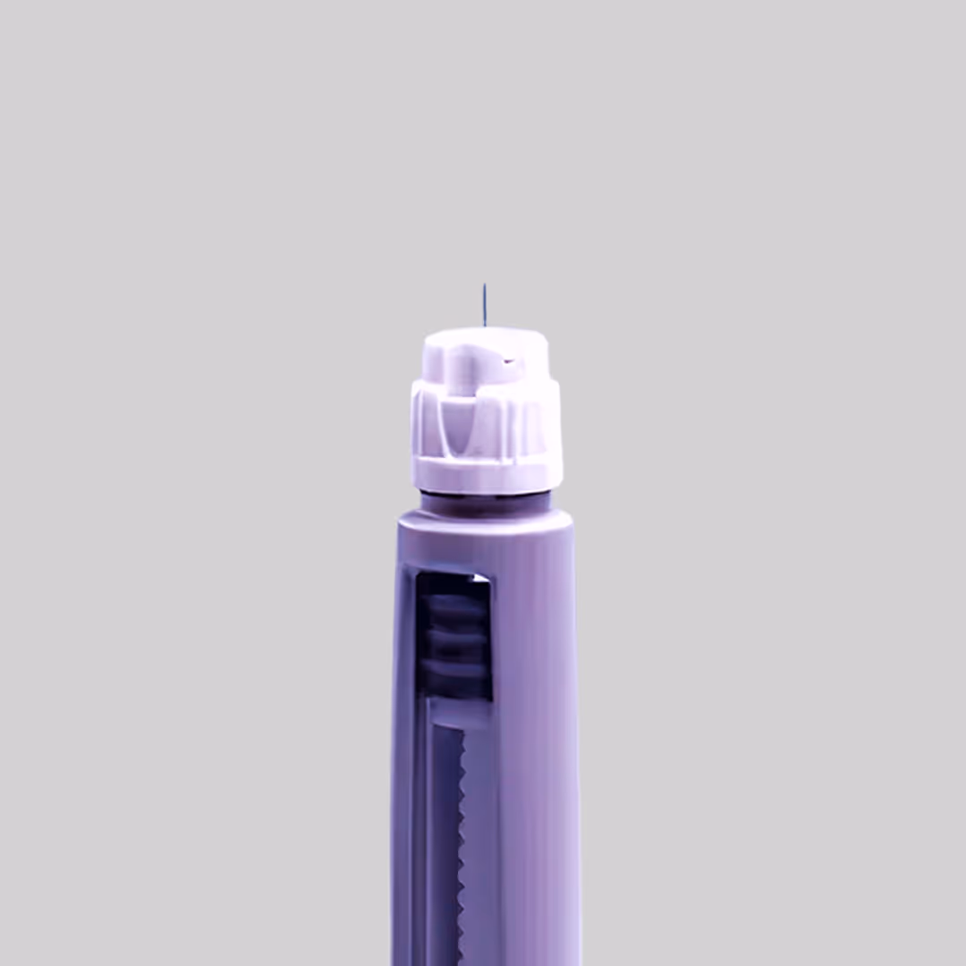 Close-up of a purple pen with a white push-button top and a visible ink cartridge.