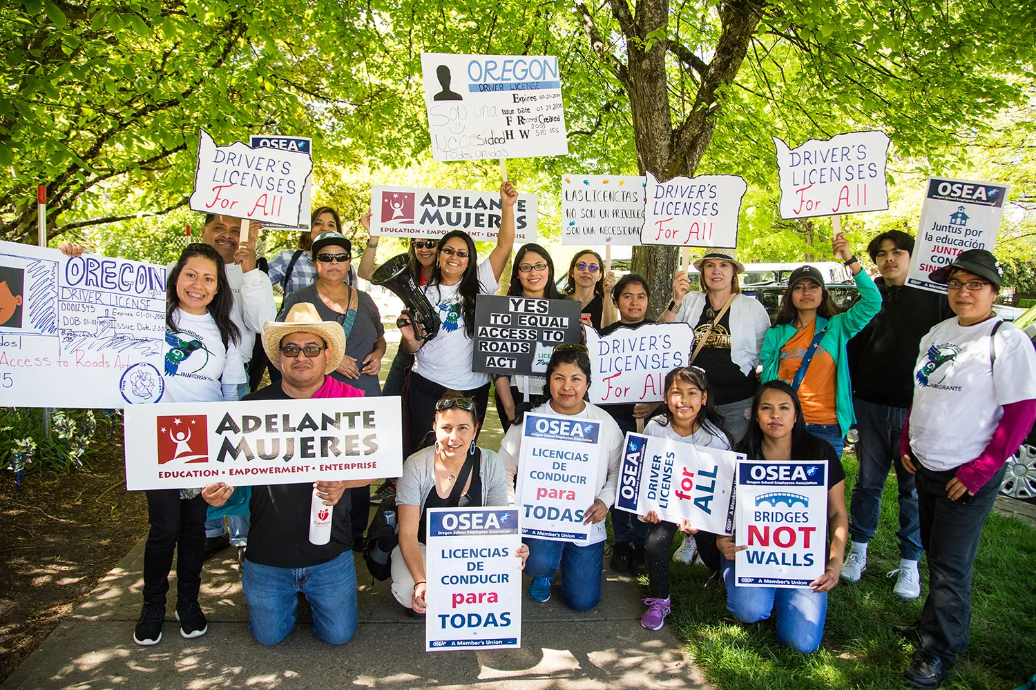 Large group of youth activists holding signs