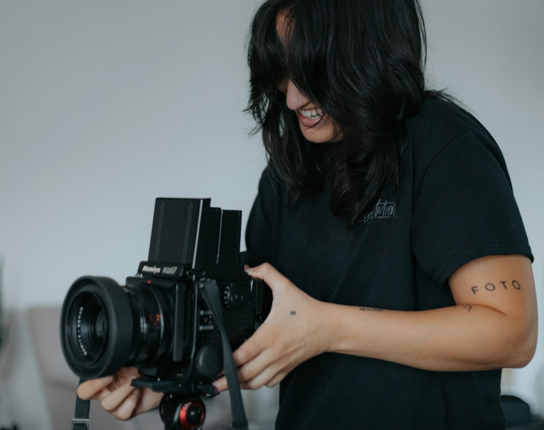 woman operating a professional video camera