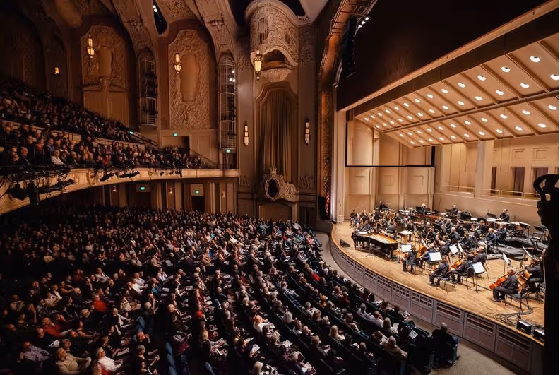 Orchestra on stage in concert hall
