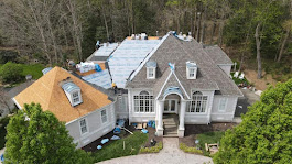 An aerial photo of a roof replacement on the installation phase of the build. The crew is installing a class 3 shingle on this home in St. Mary's County Maryland