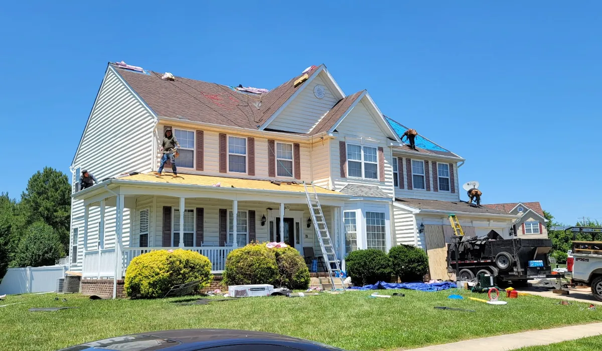 an atlas certified crew installing new shingles on a roof replacement job landed by golden eagle roofing