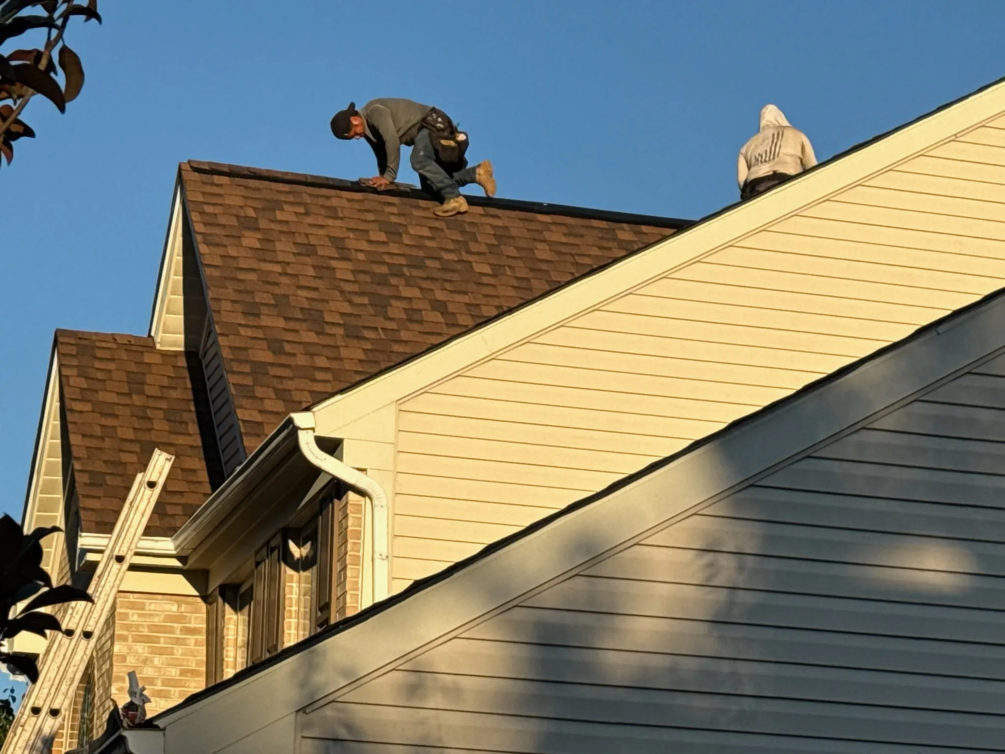 An aerial photo of a roof that was recently replaced by Golden Eagle Roofing. It showcases a black designer shingle on a Southern Maryland Home