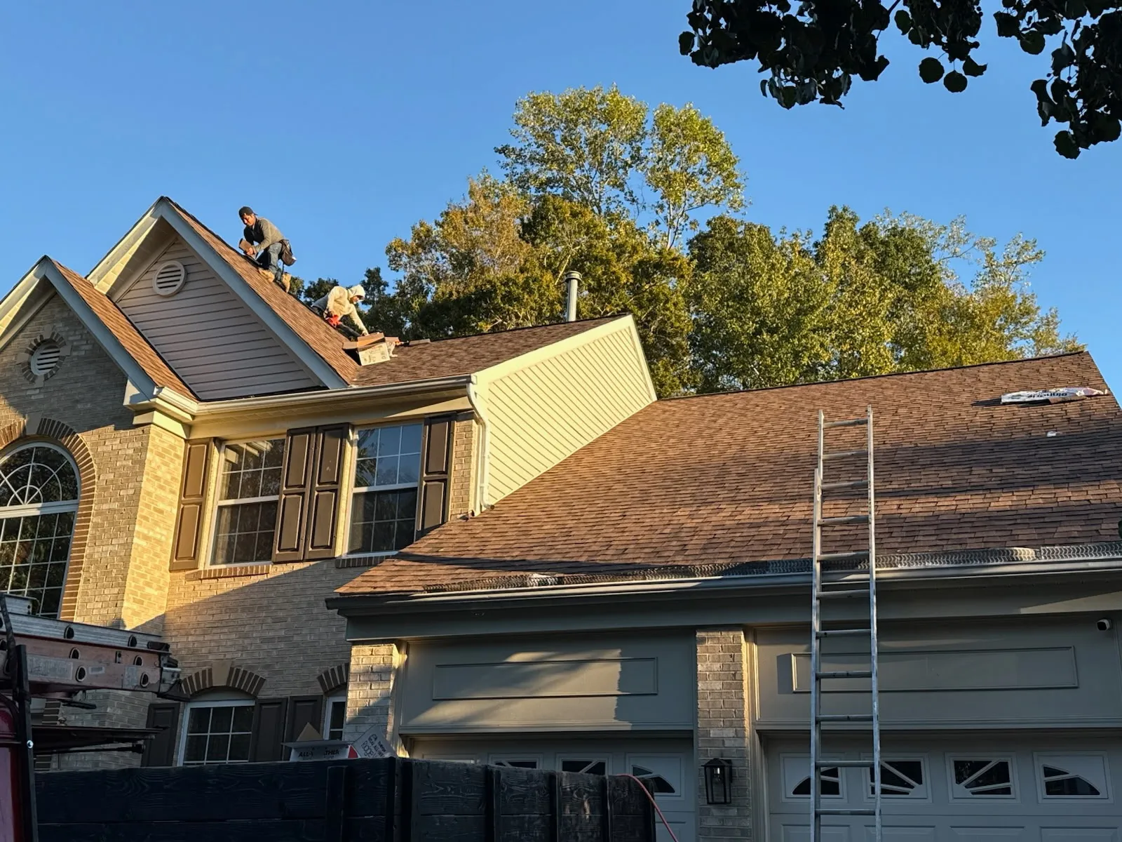 An aerial photo of a roof that was recently replaced by Golden Eagle Roofing. It showcases a black designer shingle on a Southern Maryland Home