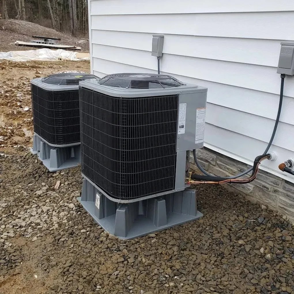 HVAC technician repairing an air conditioning unit at a residential home